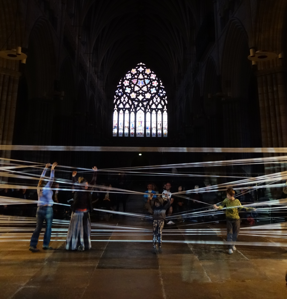 Stretch playable sculpture and performance by Sophia Clist in Exeter Cathedral for Art Week 2017. Photo Naomi Hart.